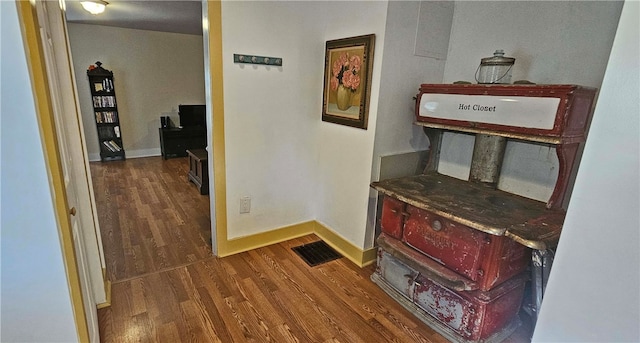 corridor featuring dark hardwood / wood-style flooring