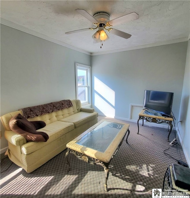 living room with crown molding, a textured ceiling, carpet, and ceiling fan