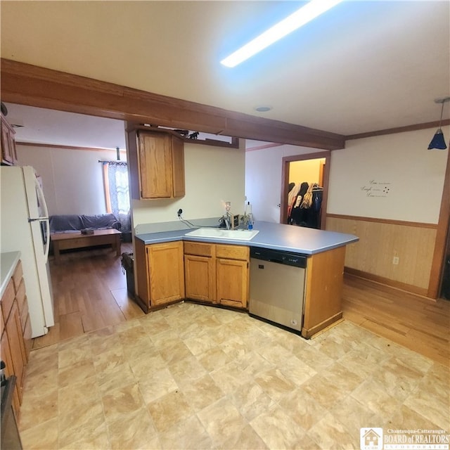 kitchen featuring white fridge, light hardwood / wood-style floors, dishwasher, and sink