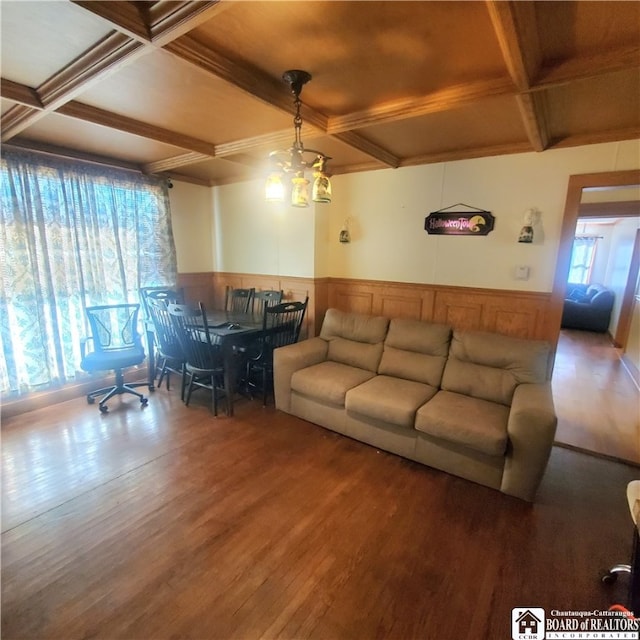 living room featuring hardwood / wood-style flooring, beamed ceiling, and coffered ceiling