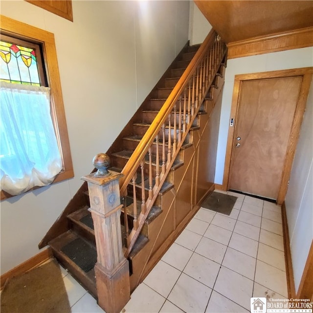 staircase with tile patterned flooring