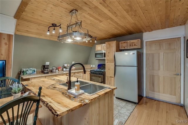 kitchen with sink, appliances with stainless steel finishes, hanging light fixtures, light brown cabinetry, and wooden ceiling