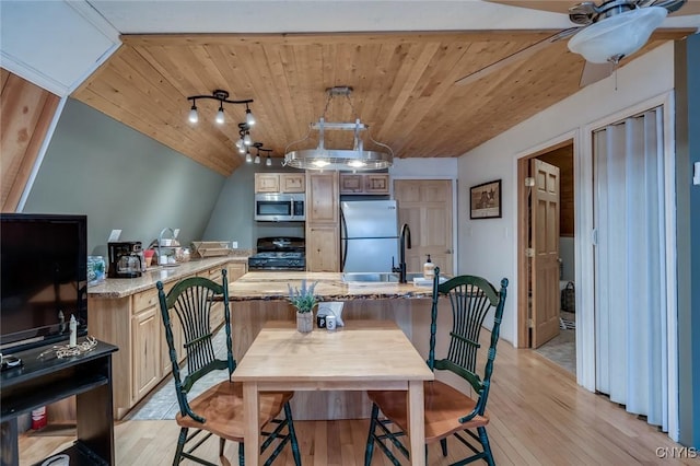 dining space with vaulted ceiling, ceiling fan, wood ceiling, and light hardwood / wood-style floors