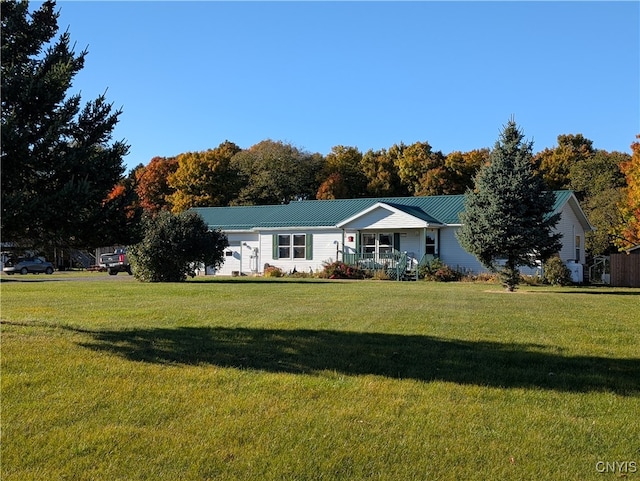 ranch-style house with a front lawn and covered porch