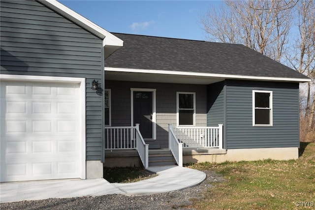 view of front of property with a porch and a garage