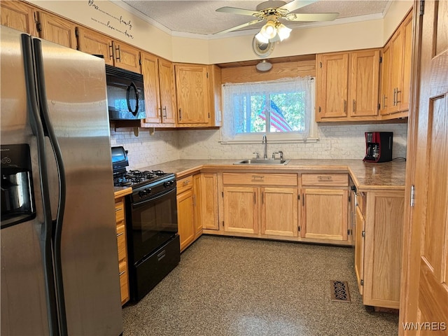 kitchen with ornamental molding, black appliances, sink, and ceiling fan