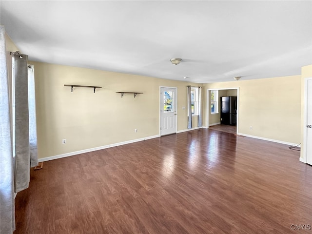 spare room with dark hardwood / wood-style flooring