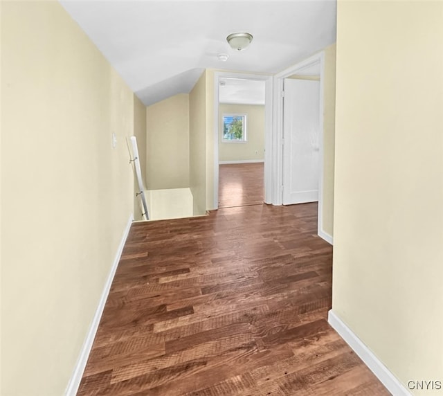 corridor with dark hardwood / wood-style floors