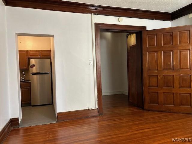 97 Linwood Ave, Buffalo, NY 14209 - spare room featuring baseboards and wood finished floors