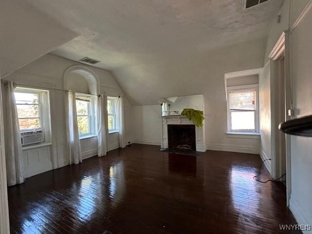 97 Linwood Ave, Buffalo, NY 14209 - unfurnished living room with baseboards, a fireplace with flush hearth, lofted ceiling, and wood finished floors
