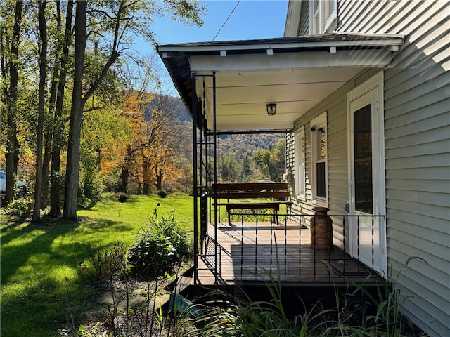 deck featuring a yard