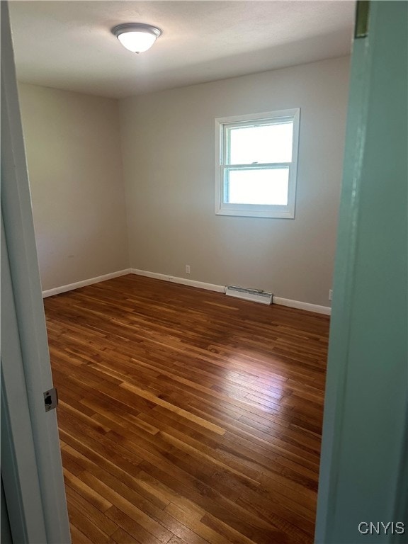 empty room featuring dark hardwood / wood-style floors