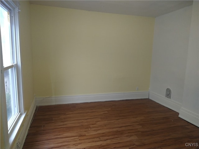 empty room featuring dark hardwood / wood-style floors