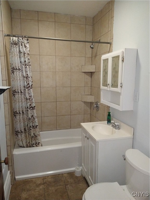 full bathroom featuring vanity, toilet, tile patterned floors, and shower / tub combo