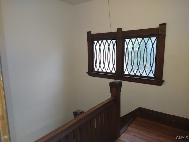 staircase featuring hardwood / wood-style flooring