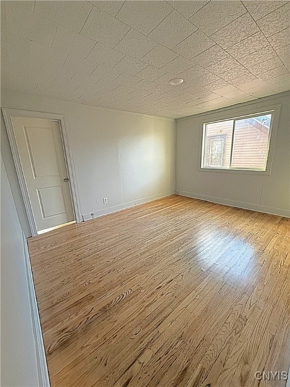 spare room featuring light hardwood / wood-style floors