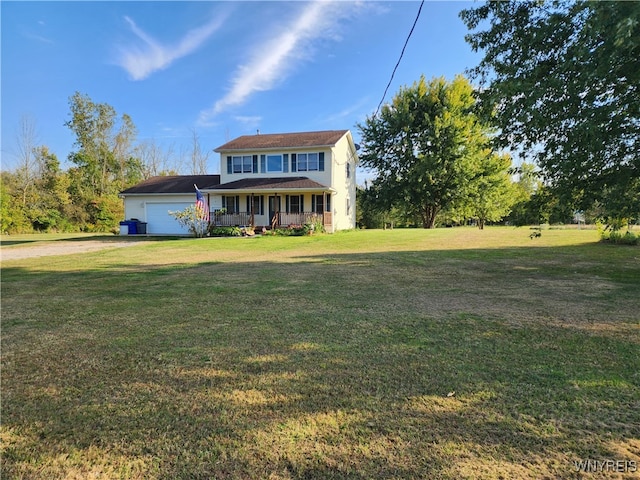 view of front of house featuring a garage, a front lawn, and a porch