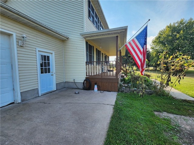 view of property exterior featuring a yard and a garage