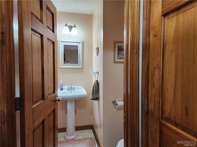 bathroom with tile patterned flooring