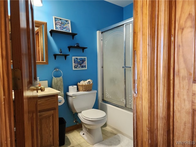 full bathroom with vanity, enclosed tub / shower combo, toilet, and tile patterned floors