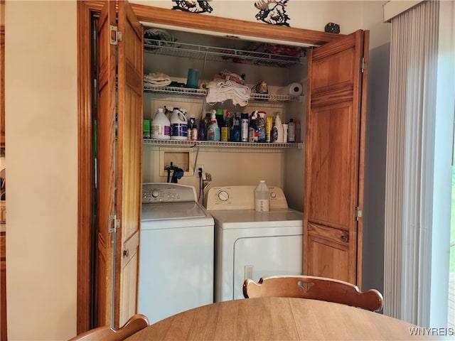 washroom with independent washer and dryer