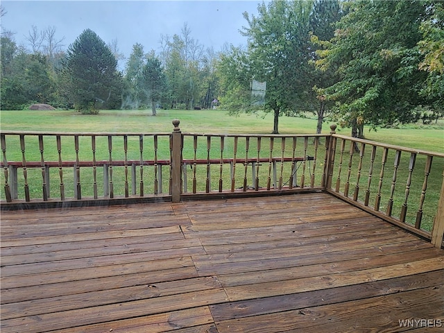 wooden deck with a lawn