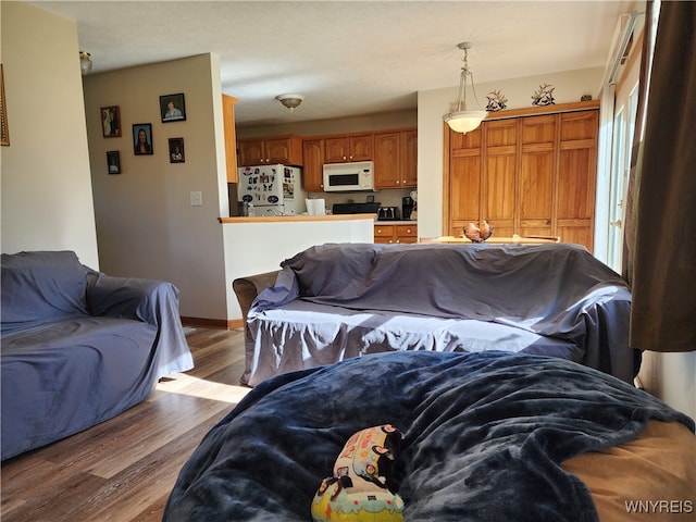 living room with hardwood / wood-style floors and a textured ceiling