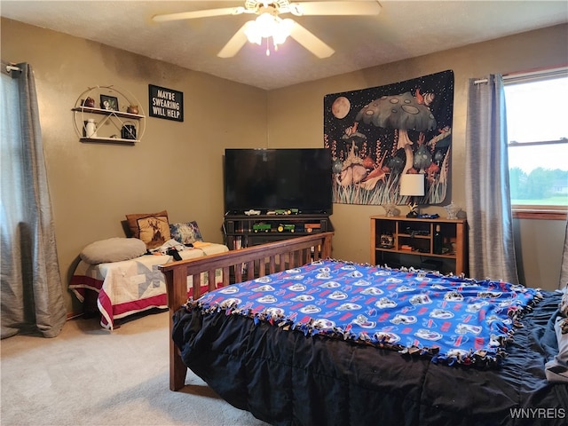 carpeted bedroom with ceiling fan