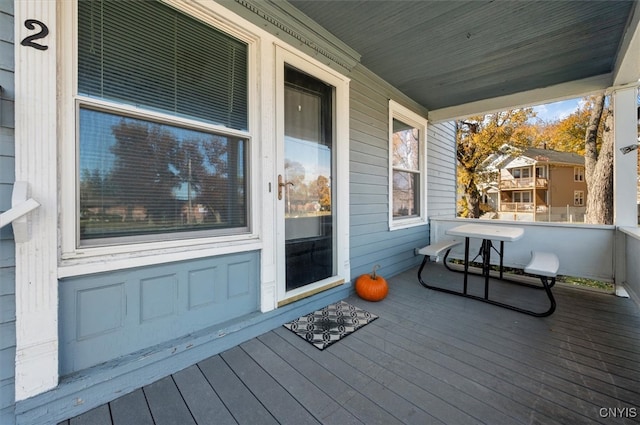 wooden terrace with a porch