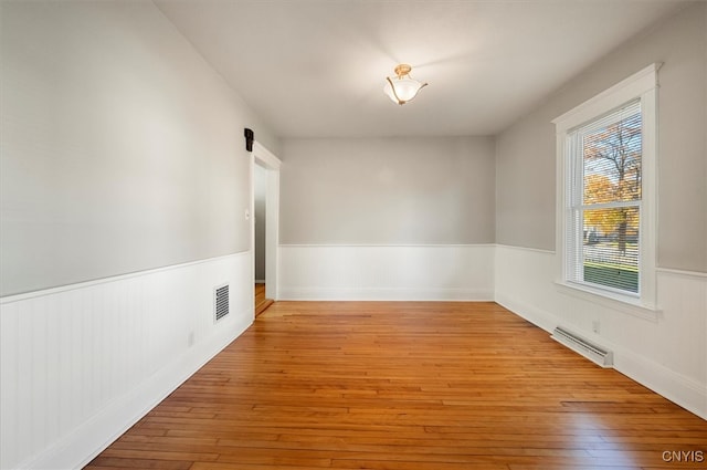 unfurnished room with light hardwood / wood-style floors