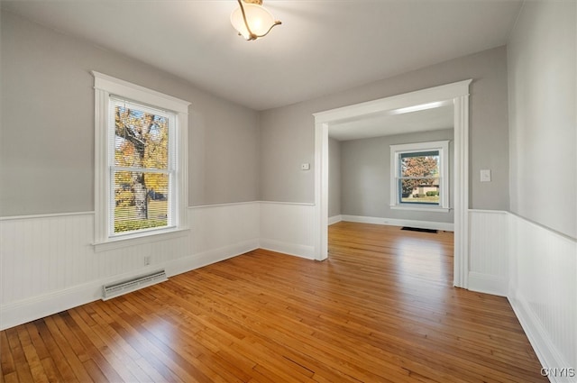 spare room featuring light hardwood / wood-style flooring