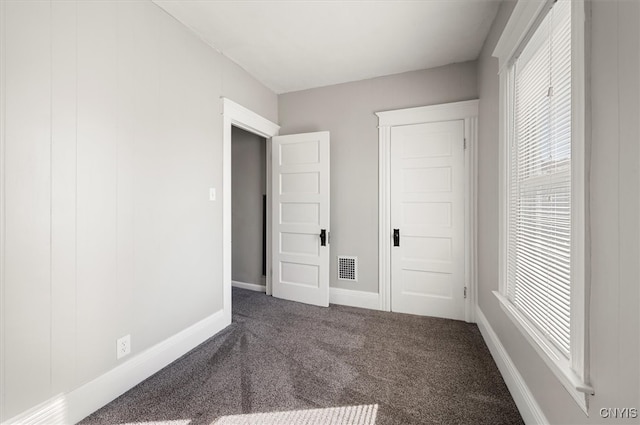 unfurnished bedroom with carpet