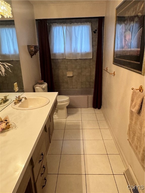 full bathroom featuring tile patterned flooring, vanity, shower / bath combination with curtain, and toilet