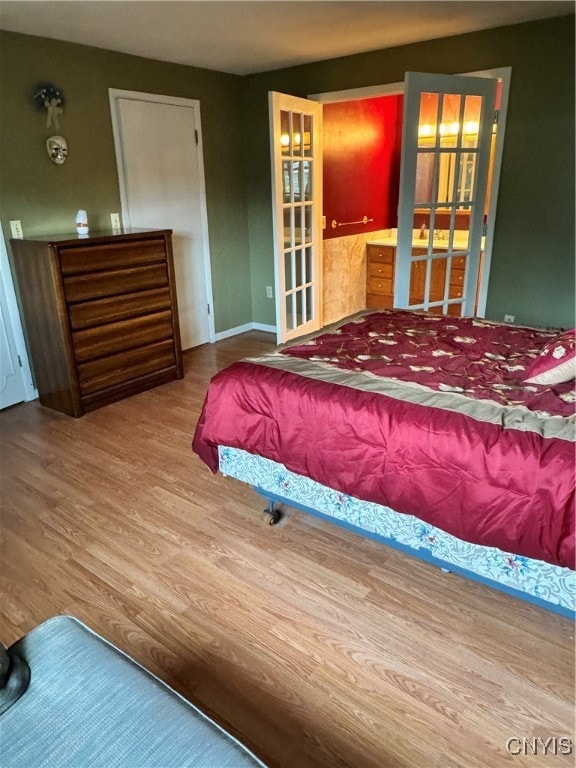 bedroom featuring hardwood / wood-style floors