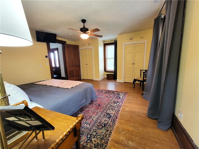 bedroom with wood-type flooring and ceiling fan