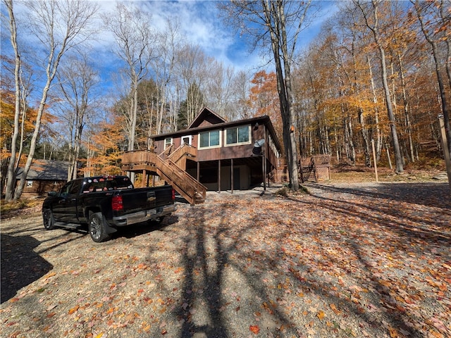 view of front facade featuring a wooden deck