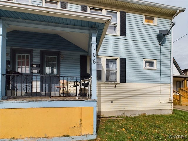 back of house with covered porch