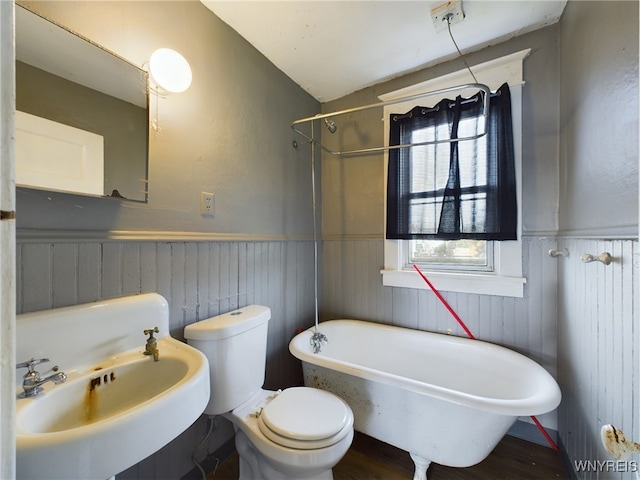 full bathroom featuring lofted ceiling, toilet, shower / tub combination, hardwood / wood-style floors, and sink