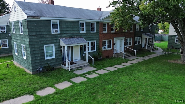 view of property with a front lawn