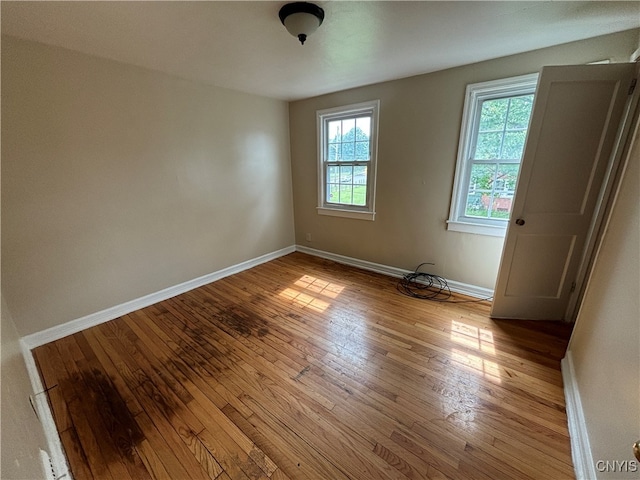 spare room featuring light wood-type flooring