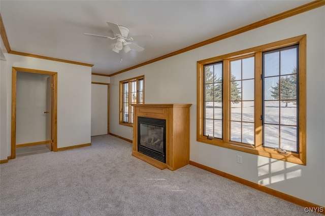 unfurnished living room with light carpet, ornamental molding, and ceiling fan