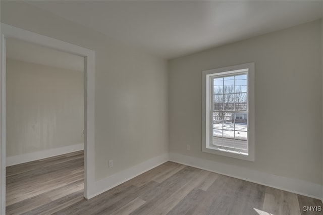 spare room featuring light hardwood / wood-style flooring