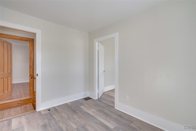 unfurnished room featuring light wood-type flooring