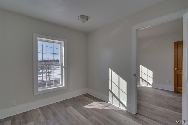 empty room with light hardwood / wood-style floors