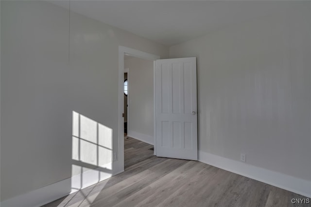 unfurnished room featuring light hardwood / wood-style floors