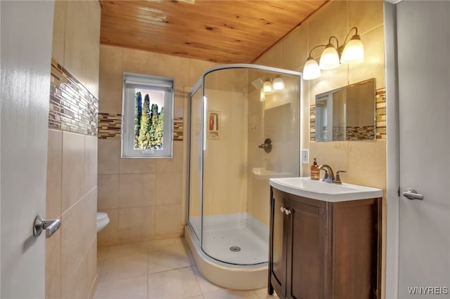 bathroom with wood ceiling, a shower with door, tile walls, toilet, and vanity