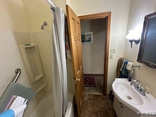 bathroom with vanity and shower / tub combo