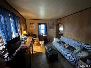 living room with wood walls