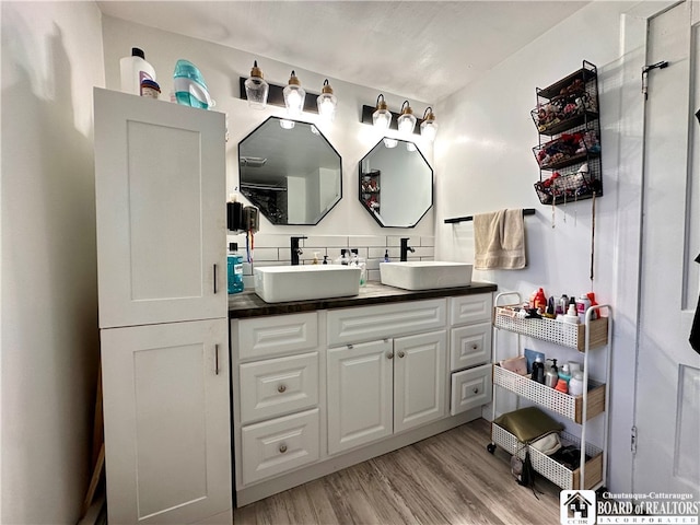 bathroom featuring vanity and wood-type flooring