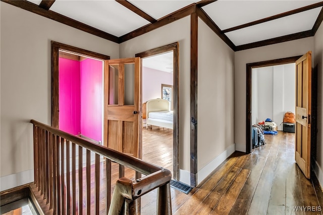 hall featuring crown molding and wood-type flooring